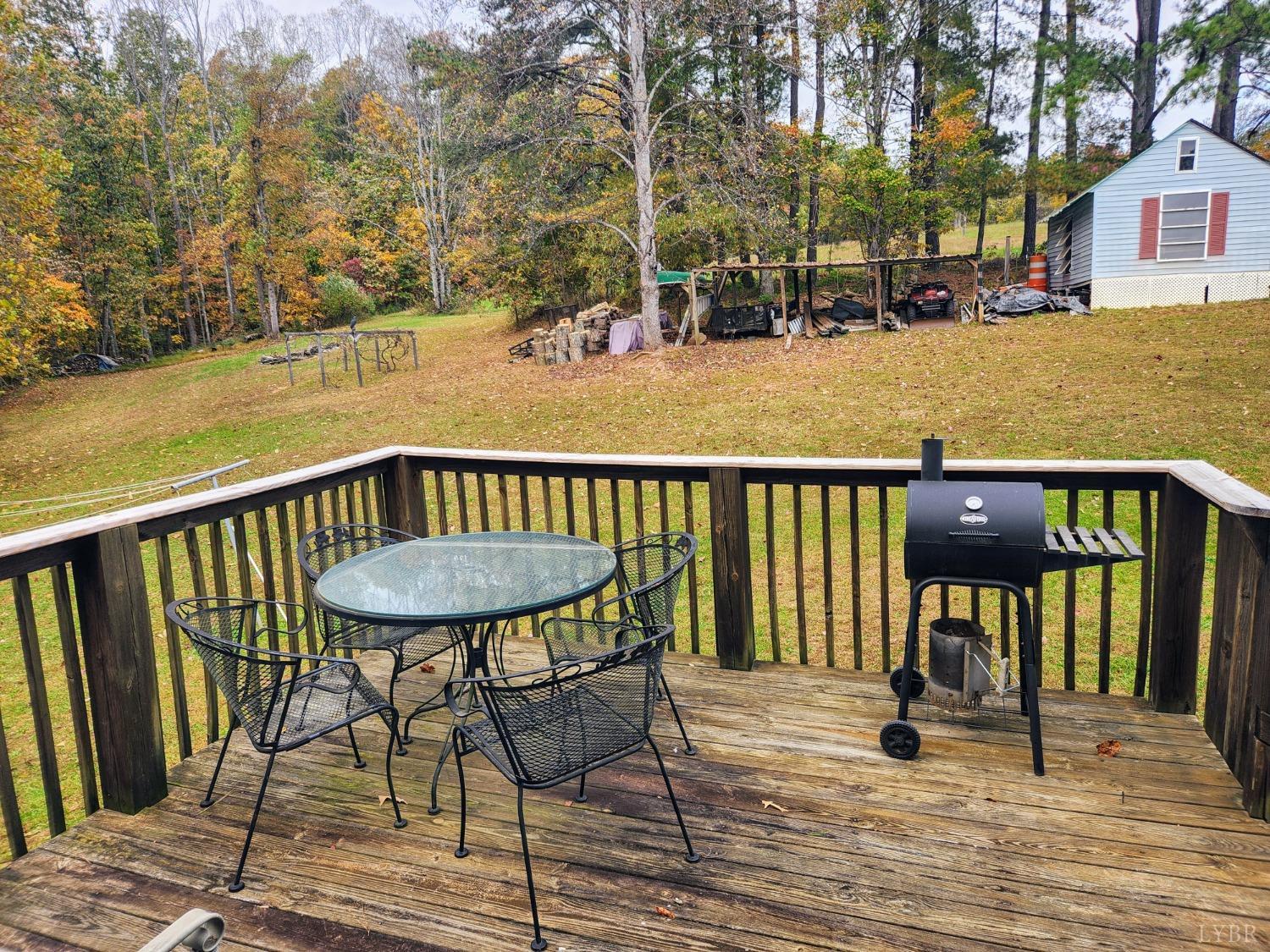 159 Buck Hill Drive Amherst, VA 24521 - Photo 7 of 31 a view of a balcony with wooden chairs and floor