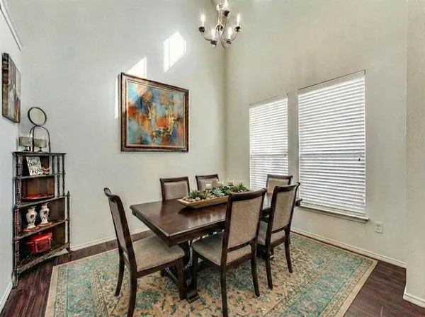 a dining room with furniture and window