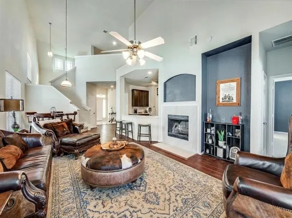 a living room with furniture and a fireplace