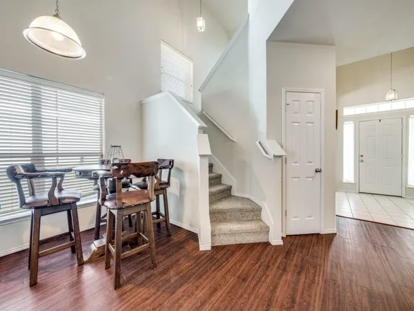 a view of a livingroom with furniture and hardwood floor