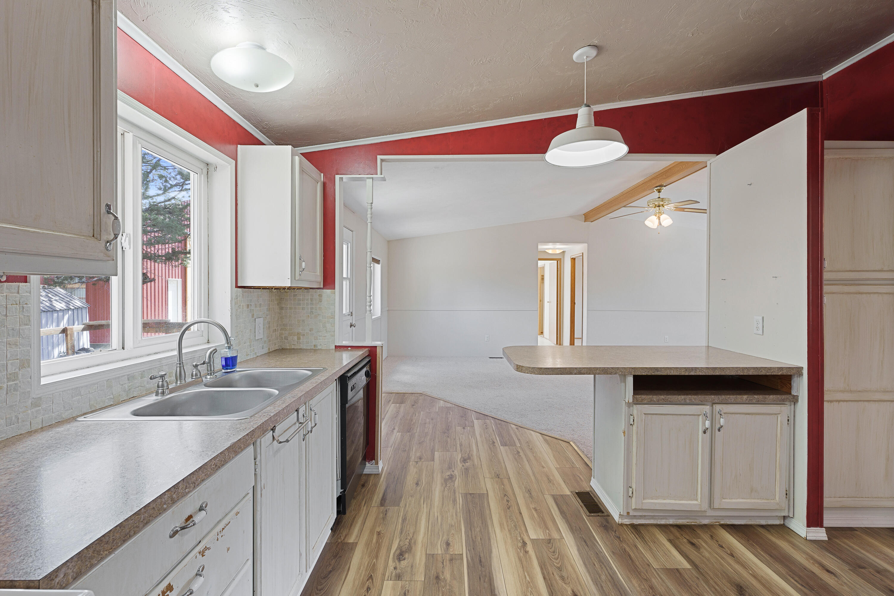 5674 Southeast Davis Loop Prineville, OR 97754 - Photo 13 of 48 a kitchen with a sink cabinets and window