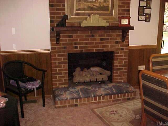 1702 Spring Drive Garner, NC 27529 - Photo 6 of 10 a living room with furniture and a fireplace