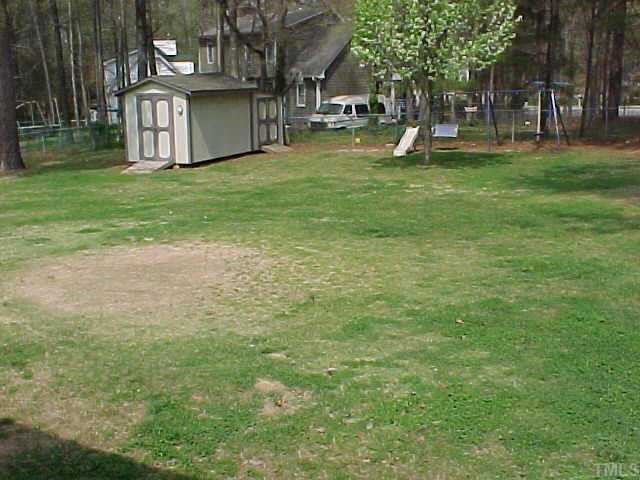 1702 Spring Drive Garner, NC 27529 - Photo 8 of 10 a view of a house with a park