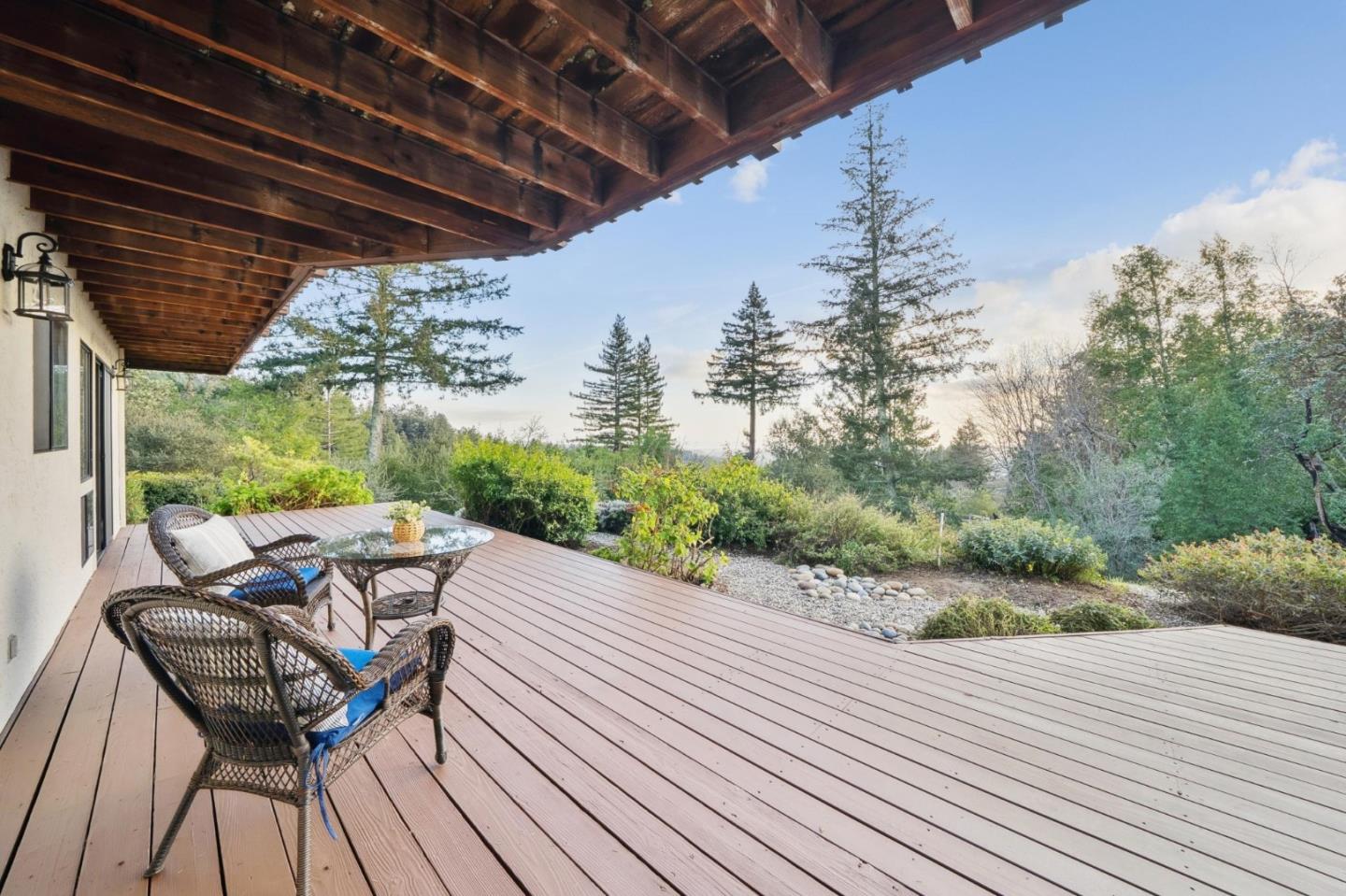 600 Ridge Top Road Los Gatos, CA 95033 - Photo 57 of 81 a view of a patio with table and chairs and wooden floor