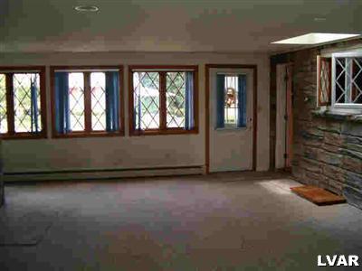 1814 Ruth Street Allentown, PA 18104 - Photo 2 of 5 wooden floor in an empty room with a window