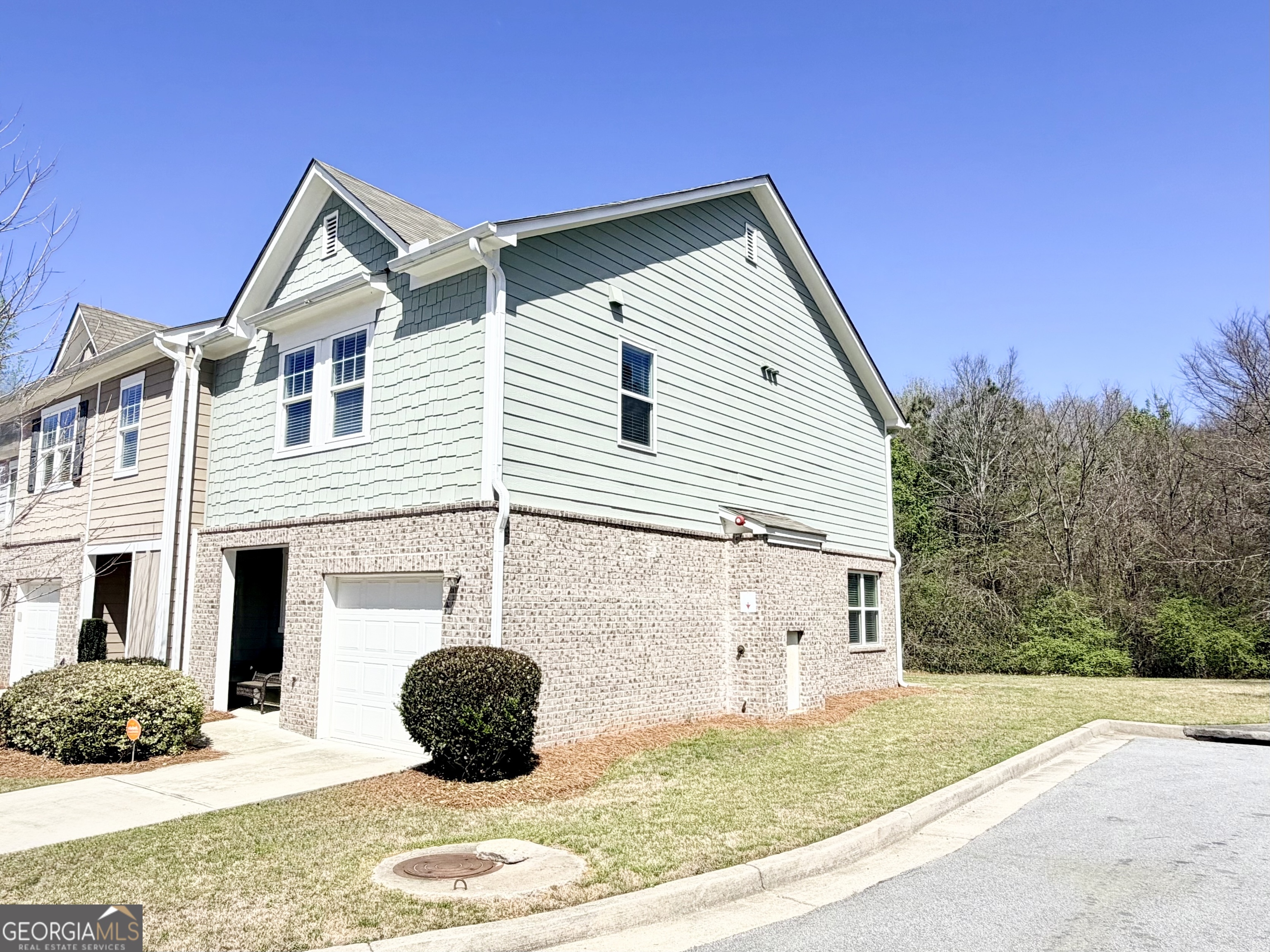 1601 Honeysuckle Path Conyers, GA 30012 - Photo 6 of 34 a front view of a house with a yard