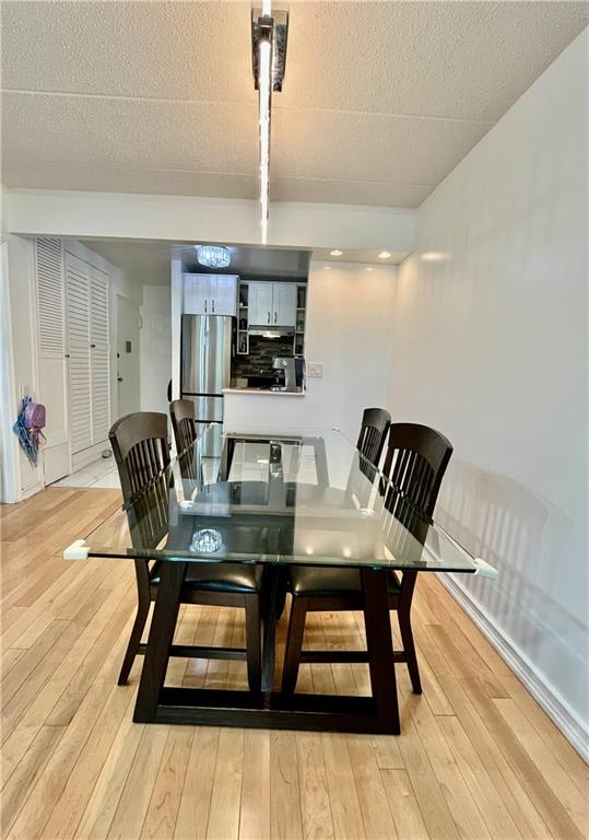 9965 Shore Road, Unit 6C Brooklyn, NY 11209 - Photo 12 of 37 a view of a dining room with furniture