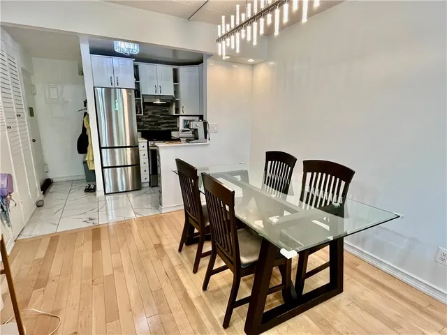 a kitchen with stainless steel appliances granite countertop a refrigerator stove a sink and dishwasher