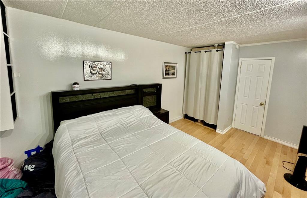 9965 Shore Road, Unit 6C Brooklyn, NY 11209 - Photo 24 of 37 a bedroom with a bed and a window