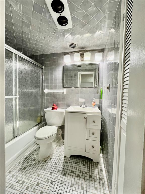 9965 Shore Road, Unit 6C Brooklyn, NY 11209 - Photo 25 of 37 a bathroom with a sink toilet and shower