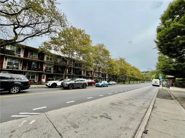a view of street with tall buildings