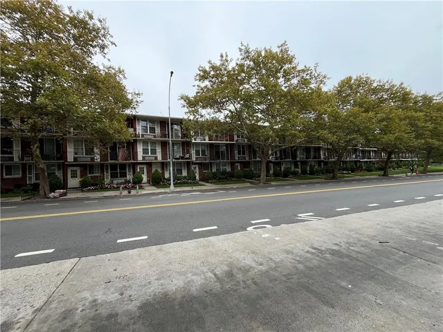 a view of a street with cars on road