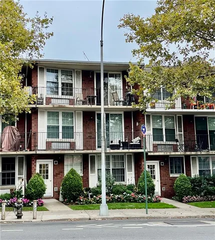 a view of a house with garden and deck