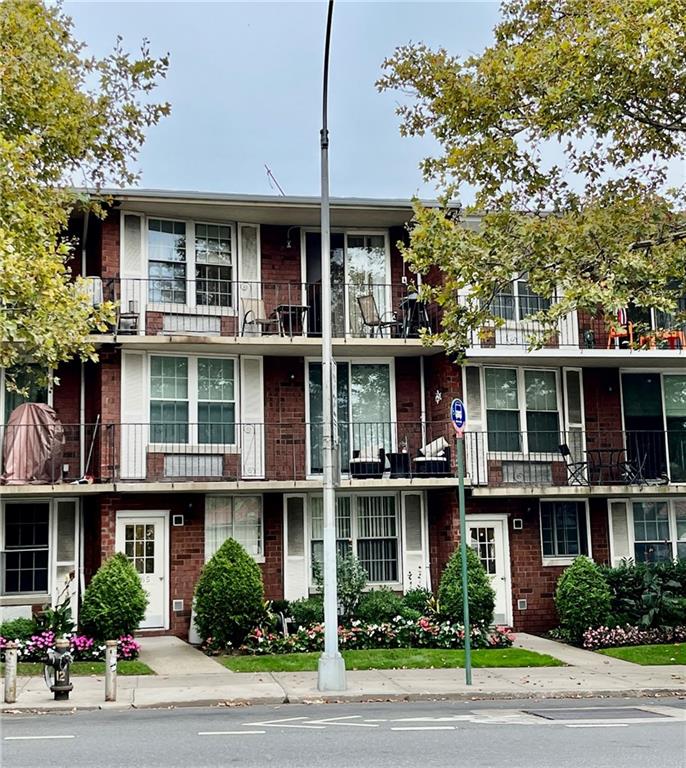 9965 Shore Road, Unit 6C Brooklyn, NY 11209 - Photo 34 of 37 a front view of a building with street view
