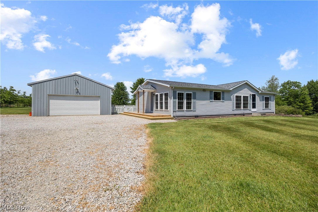 294 Twp 150 Road Sullivan, OH 44880 - Photo 6 of 39 Single-story residence featuring a gray exterior siding and a light gray roof