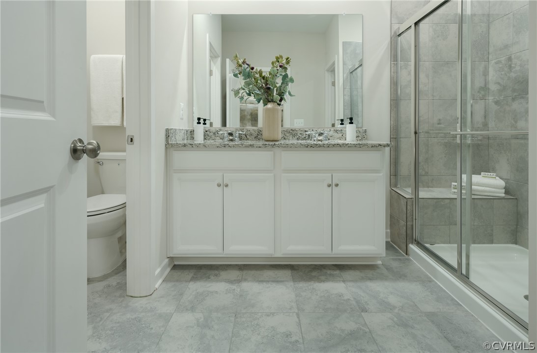8931 Lewdown Place Chesterfield, VA 23832 - Photo 14 of 19 a bathroom with a granite countertop sink and mirror