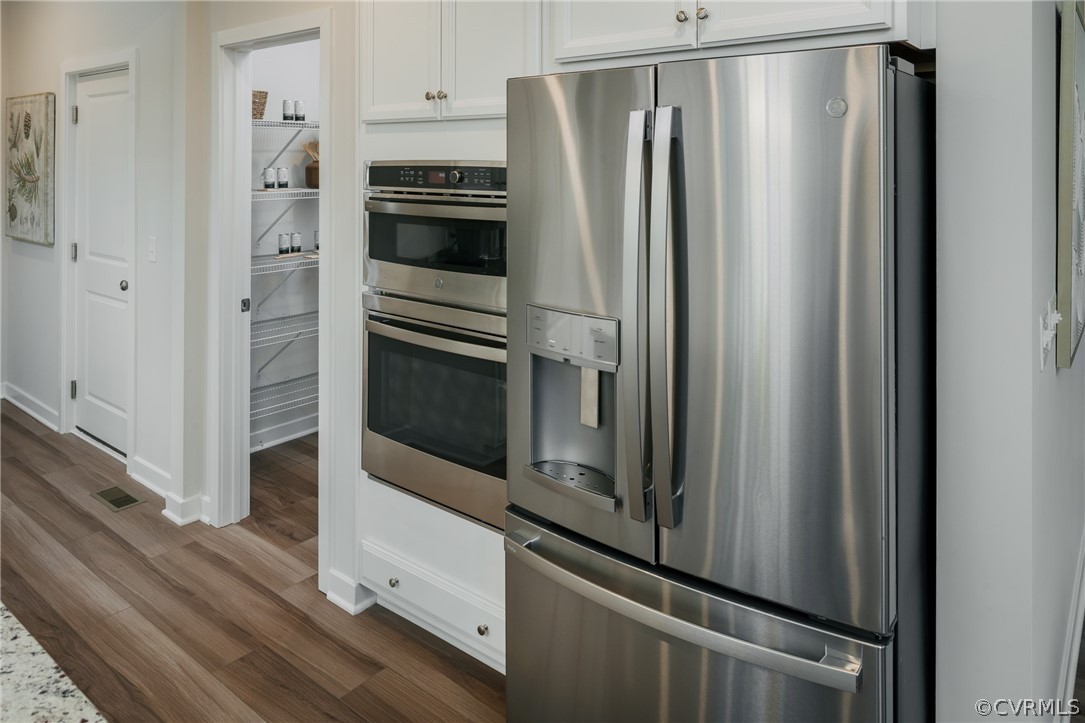8931 Lewdown Place Chesterfield, VA 23832 - Photo 7 of 19 a metallic refrigerator freezer sitting in a kitchen