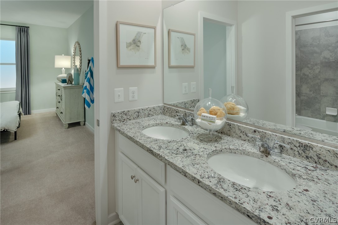 8931 Lewdown Place Chesterfield, VA 23832 - Photo 10 of 19 a bathroom with a granite countertop sink and a mirror