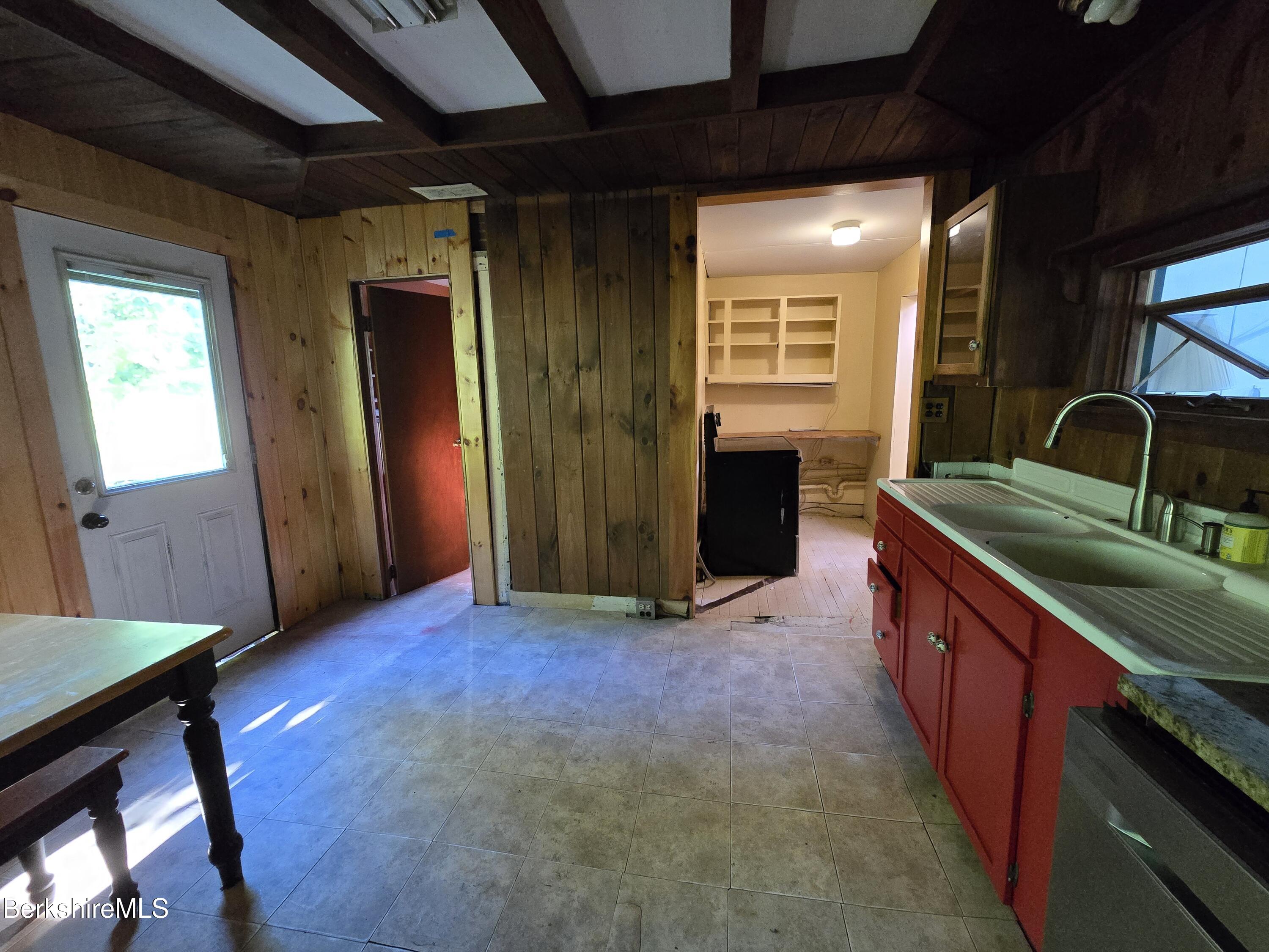 450 River Road Clarksburg, MA 01247 - Photo 11 of 45 a kitchen with stainless steel appliances granite countertop a sink stove and cabinets