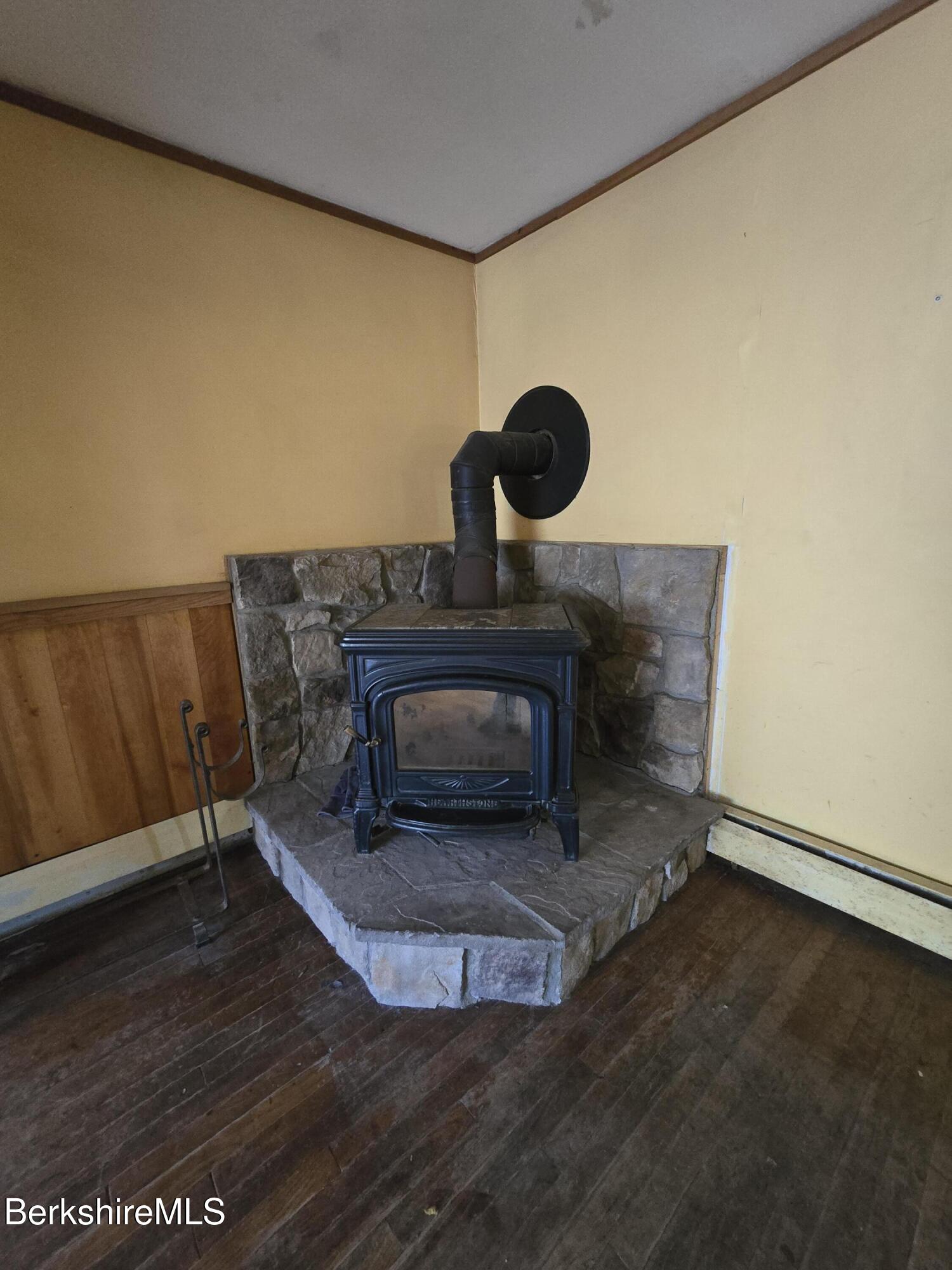 450 River Road Clarksburg, MA 01247 - Photo 21 of 45 a living room with a fireplace