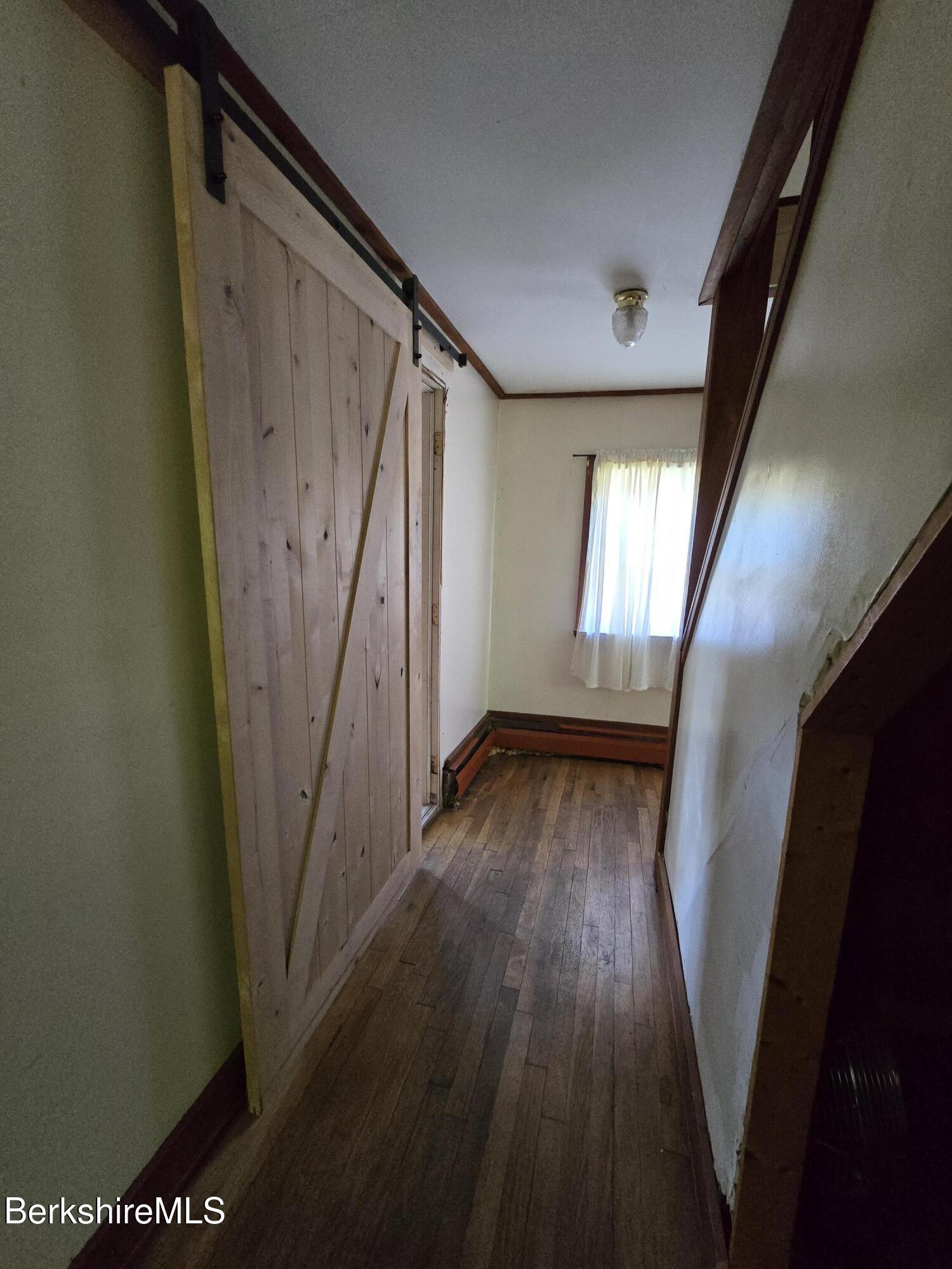 450 River Road Clarksburg, MA 01247 - Photo 30 of 45 a view of a hallway with wooden floor and stairs