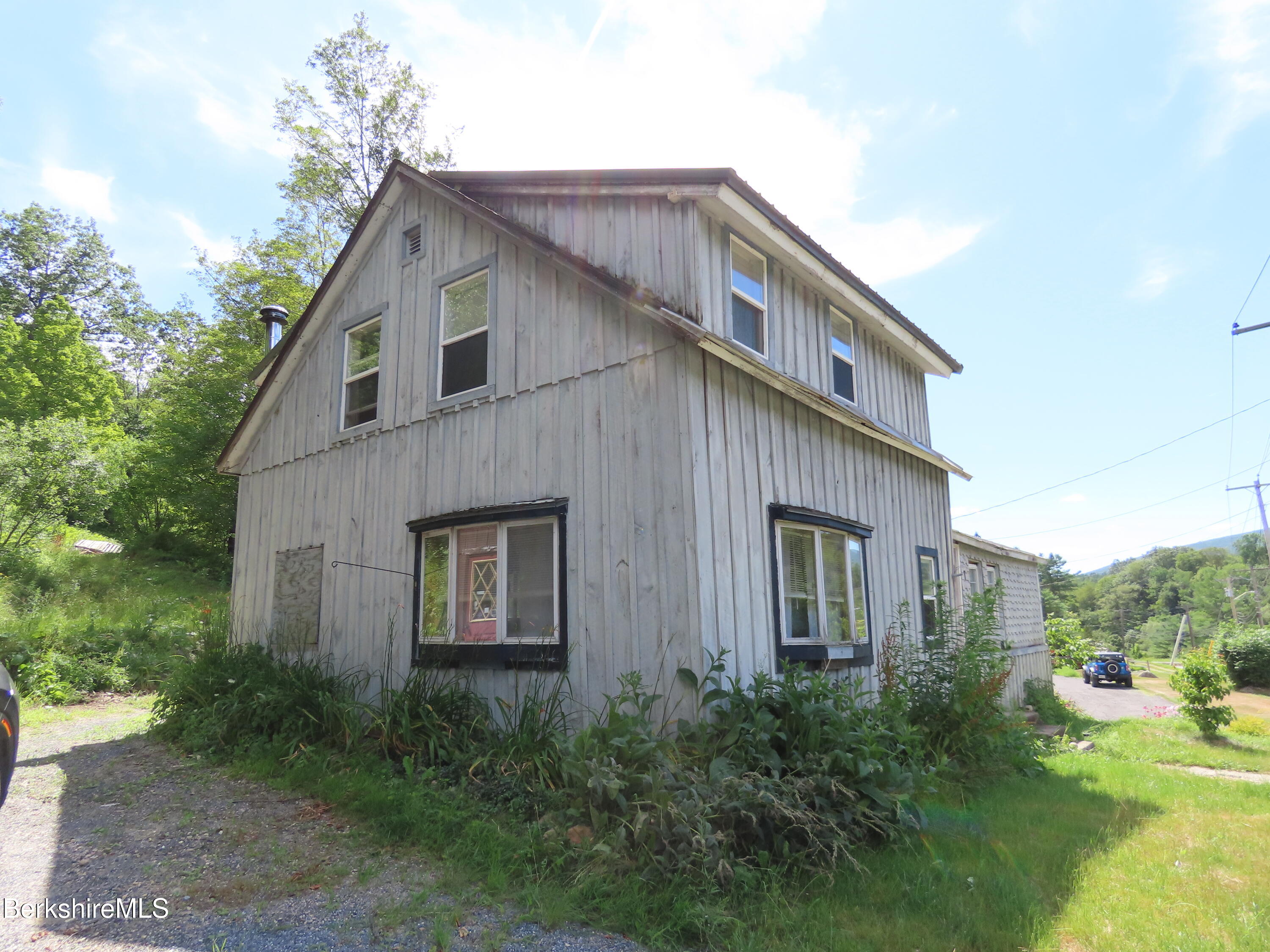 450 River Road Clarksburg, MA 01247 - Photo 39 of 45 a front view of a house with garden