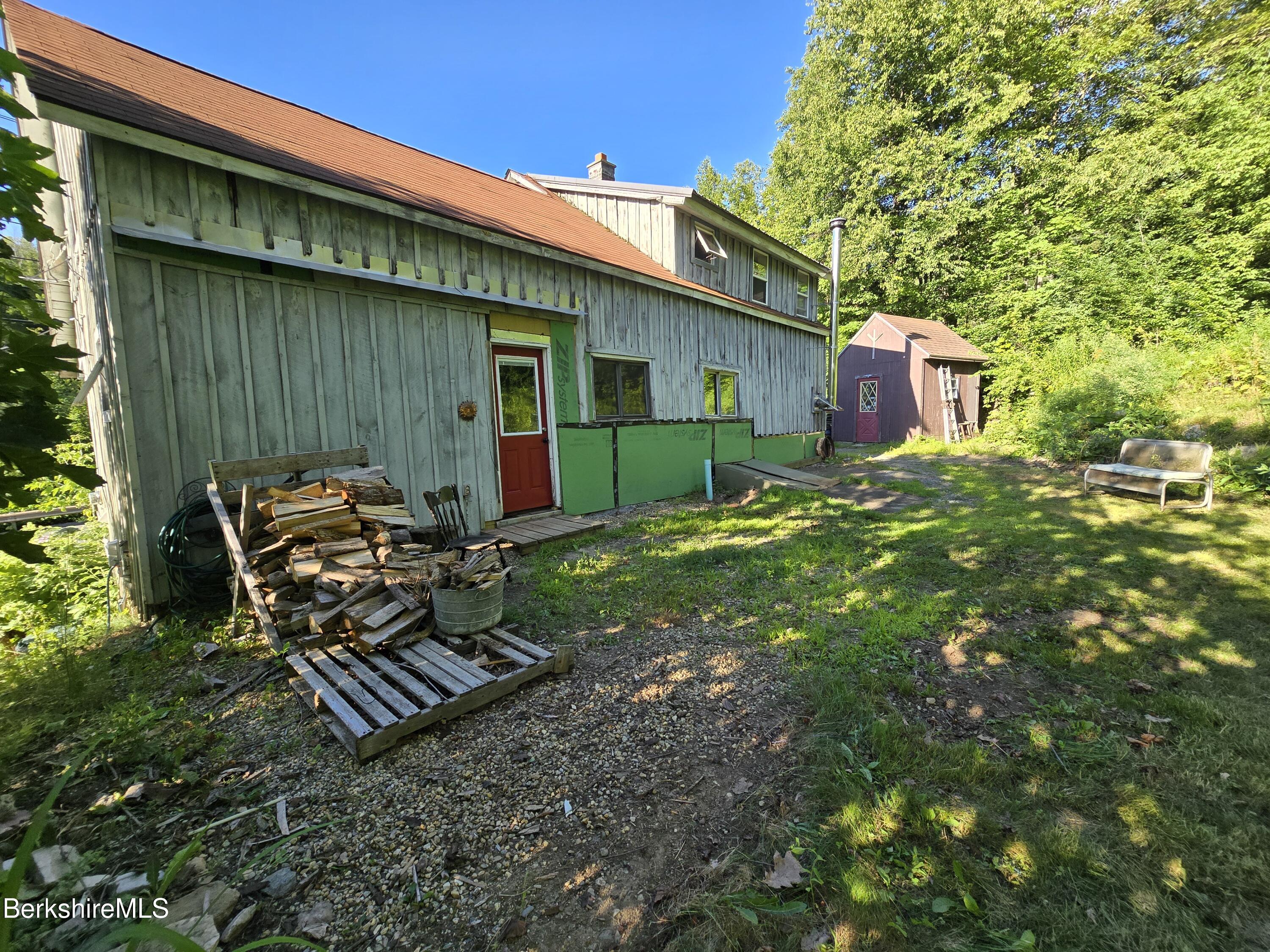 450 River Road Clarksburg, MA 01247 - Photo 43 of 45 a backyard of a house with table and chairs