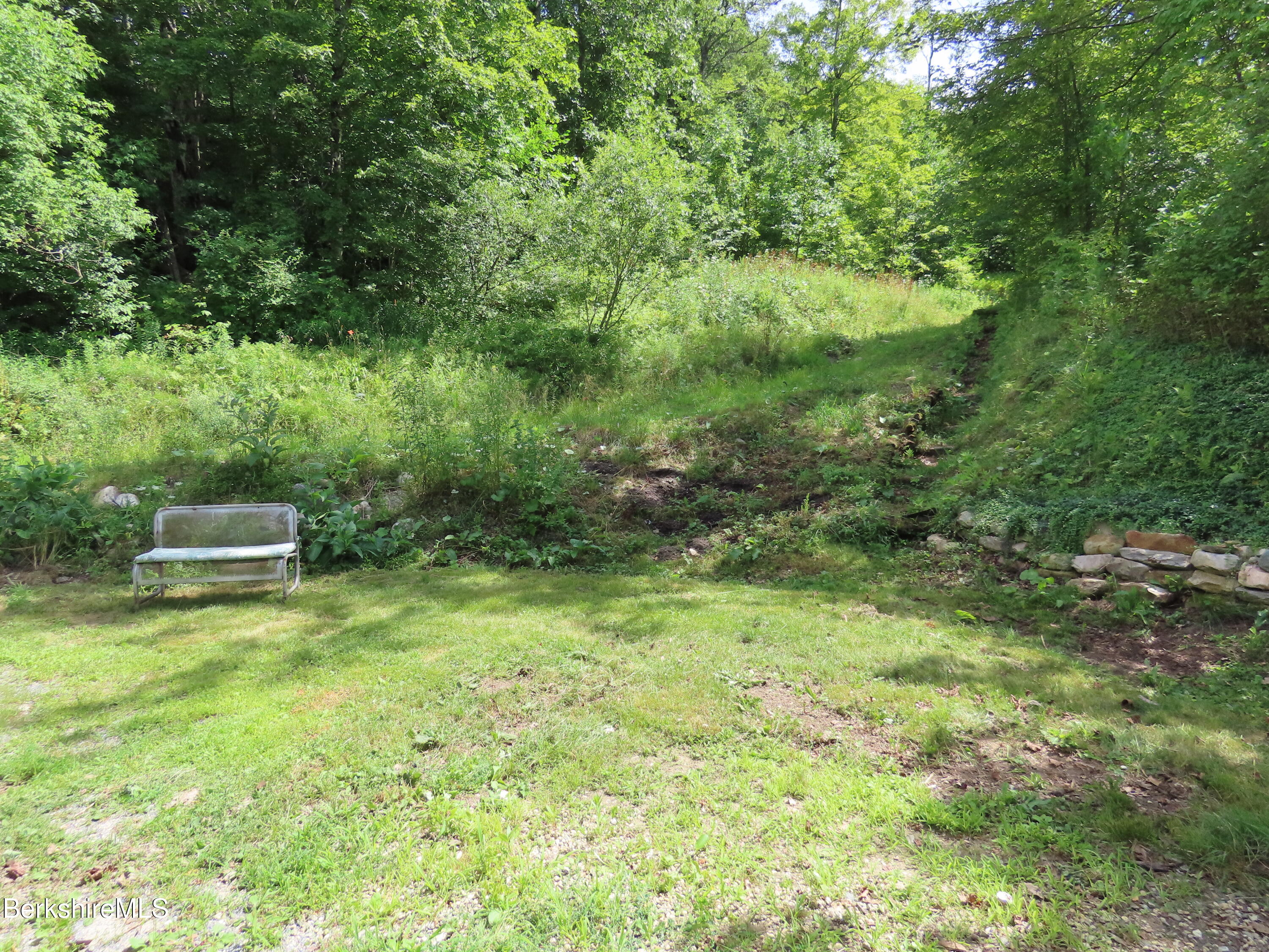 450 River Road Clarksburg, MA 01247 - Photo 5 of 45 a view of a garden with a bench