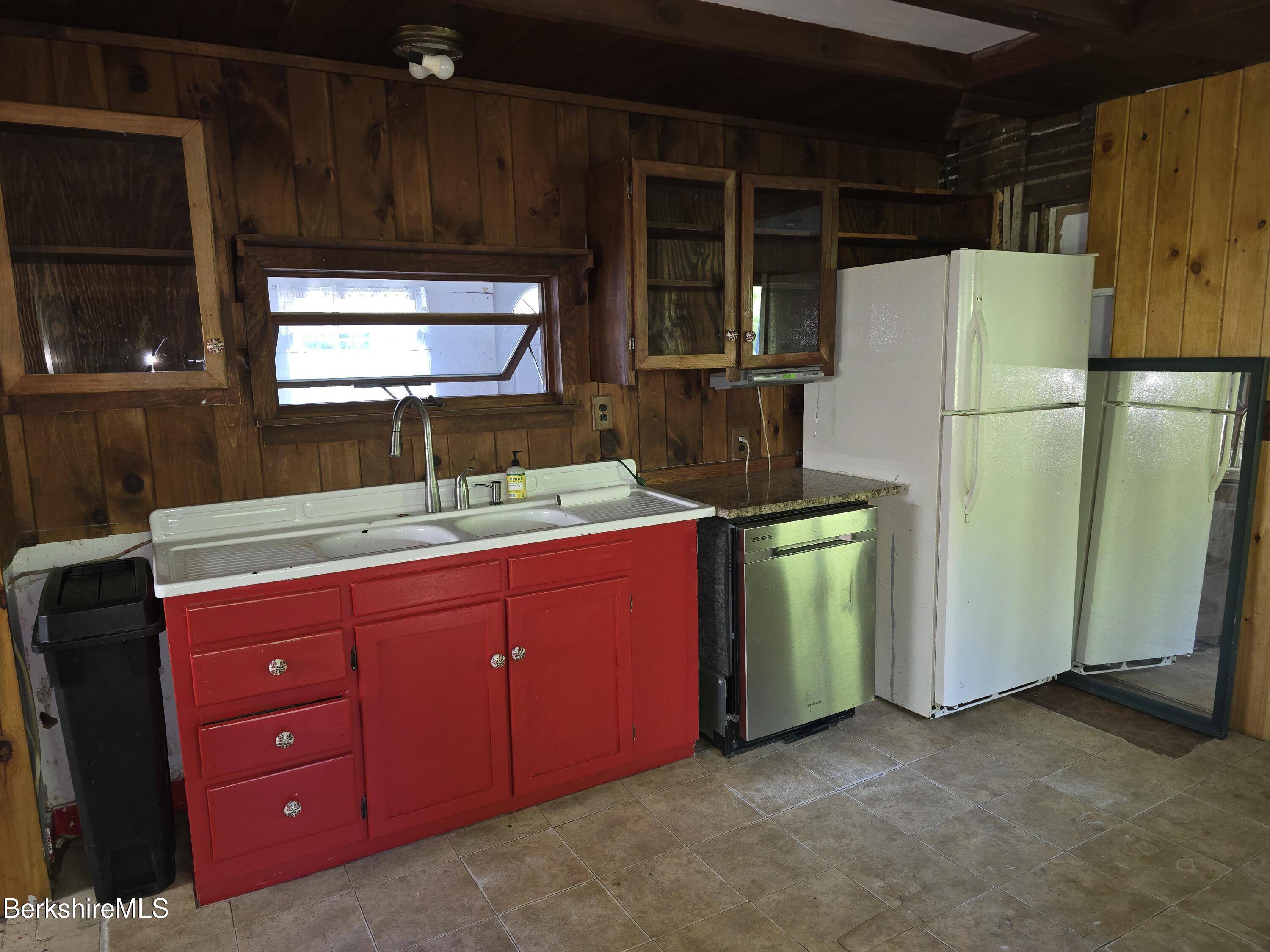 450 River Road Clarksburg, MA 01247 - Photo 7 of 45 a kitchen with sink a refrigerator and cabinets