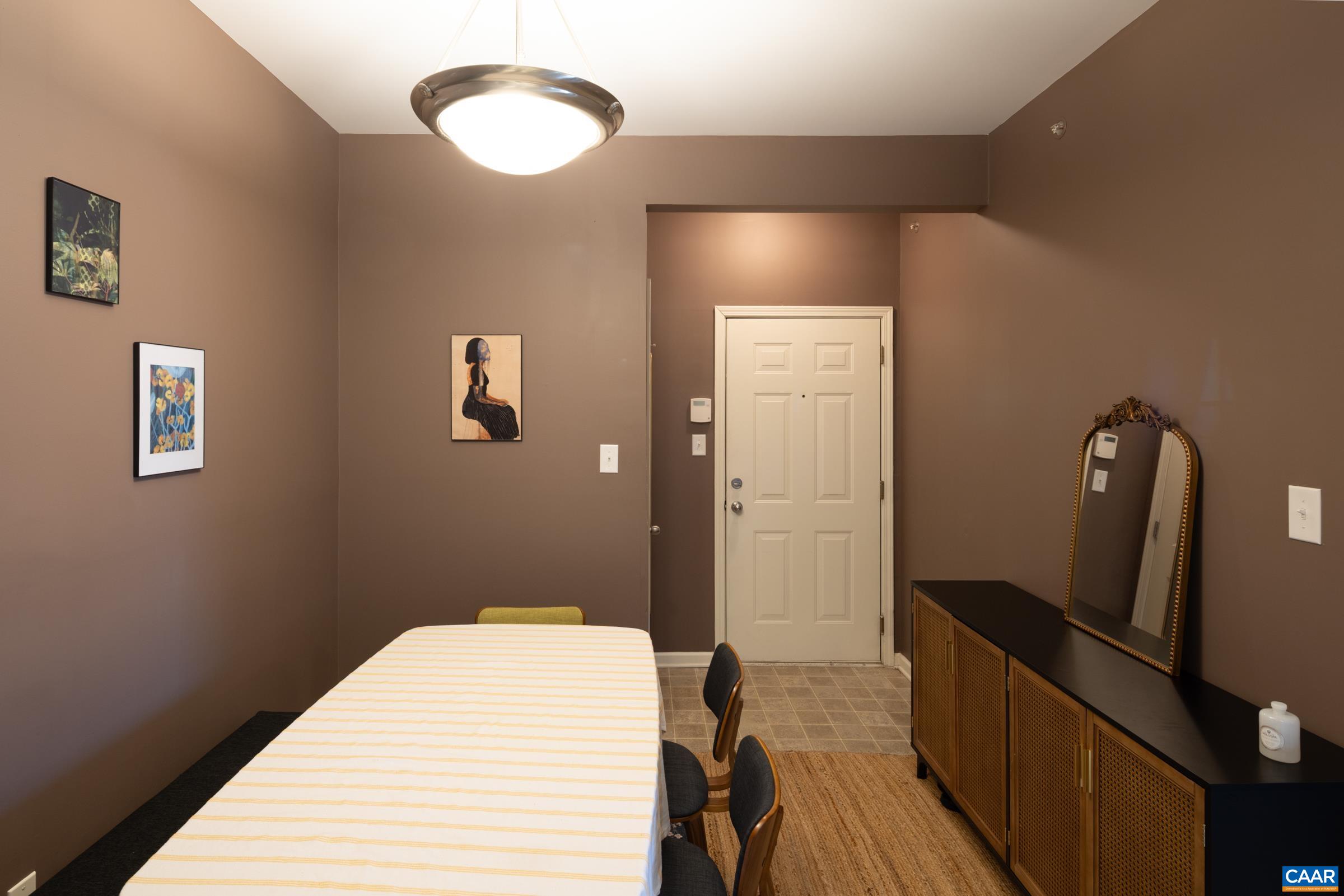 750 Walker Square, Unit 3D Charlottesville, VA 22903 - Photo 13 of 18 a bedroom with a bed and wooden floor
