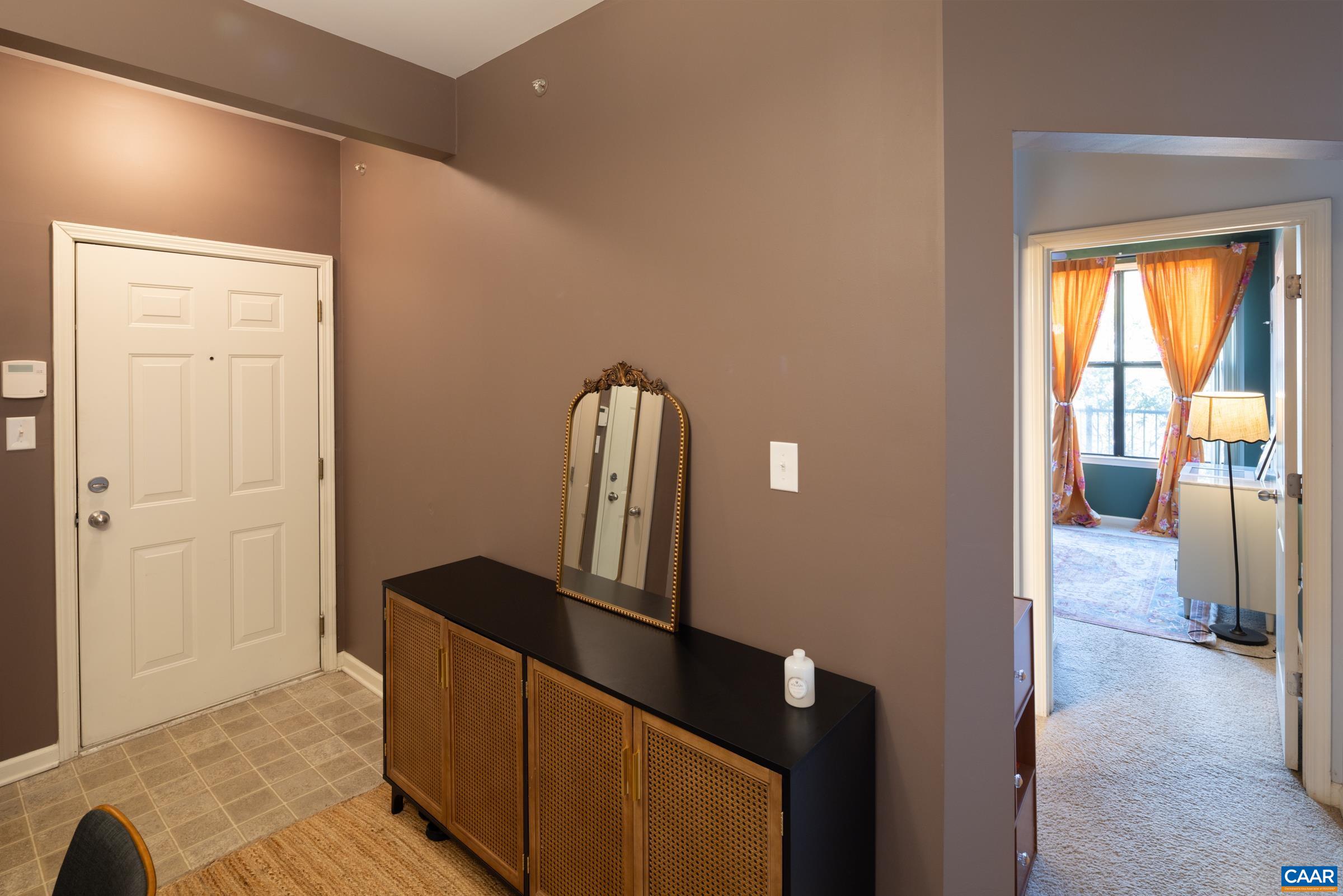 750 Walker Square, Unit 3D Charlottesville, VA 22903 - Photo 14 of 18 a view of hallway with furniture and a large window