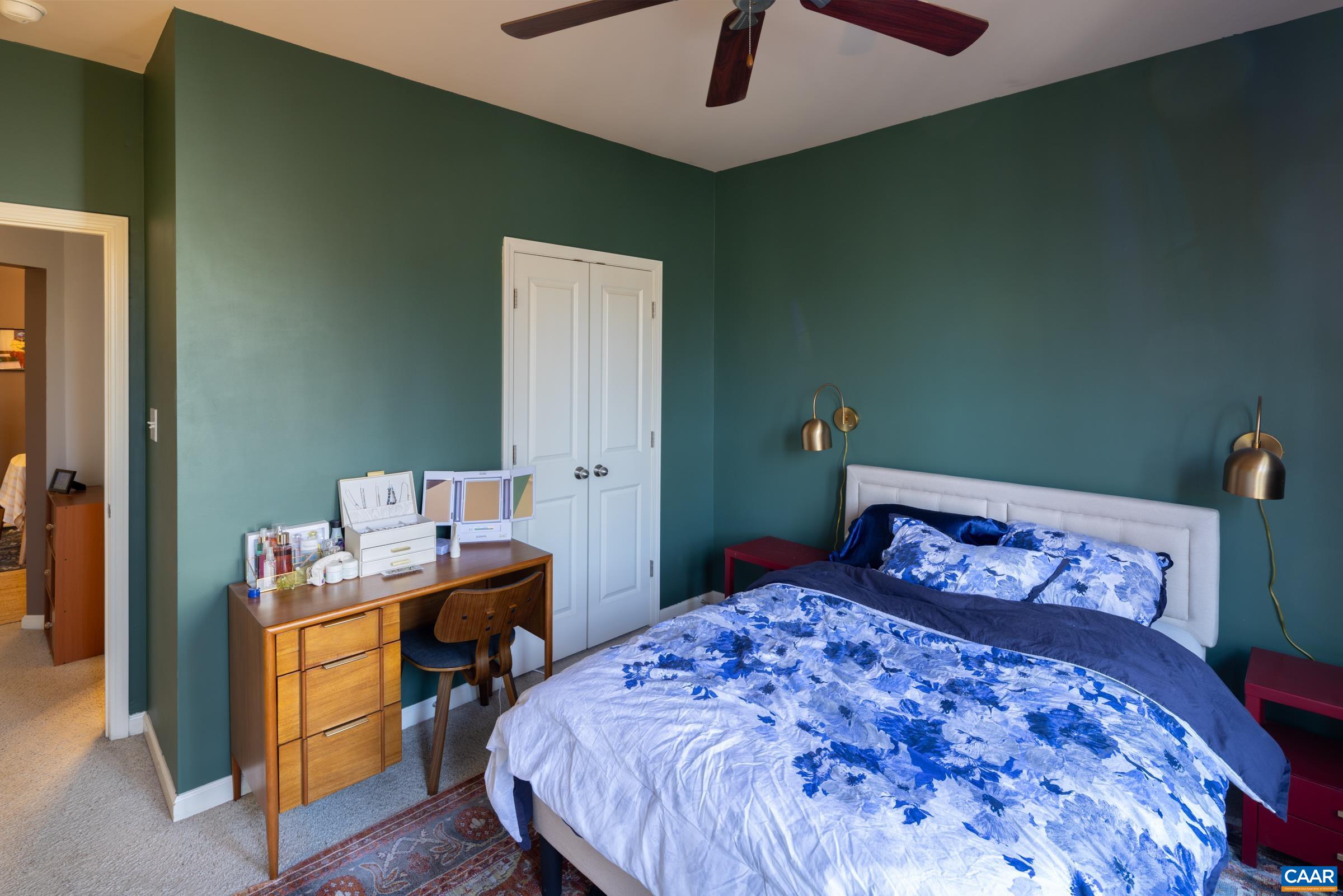 750 Walker Square, Unit 3D Charlottesville, VA 22903 - Photo 17 of 18 a bedroom with a bed and a table in it