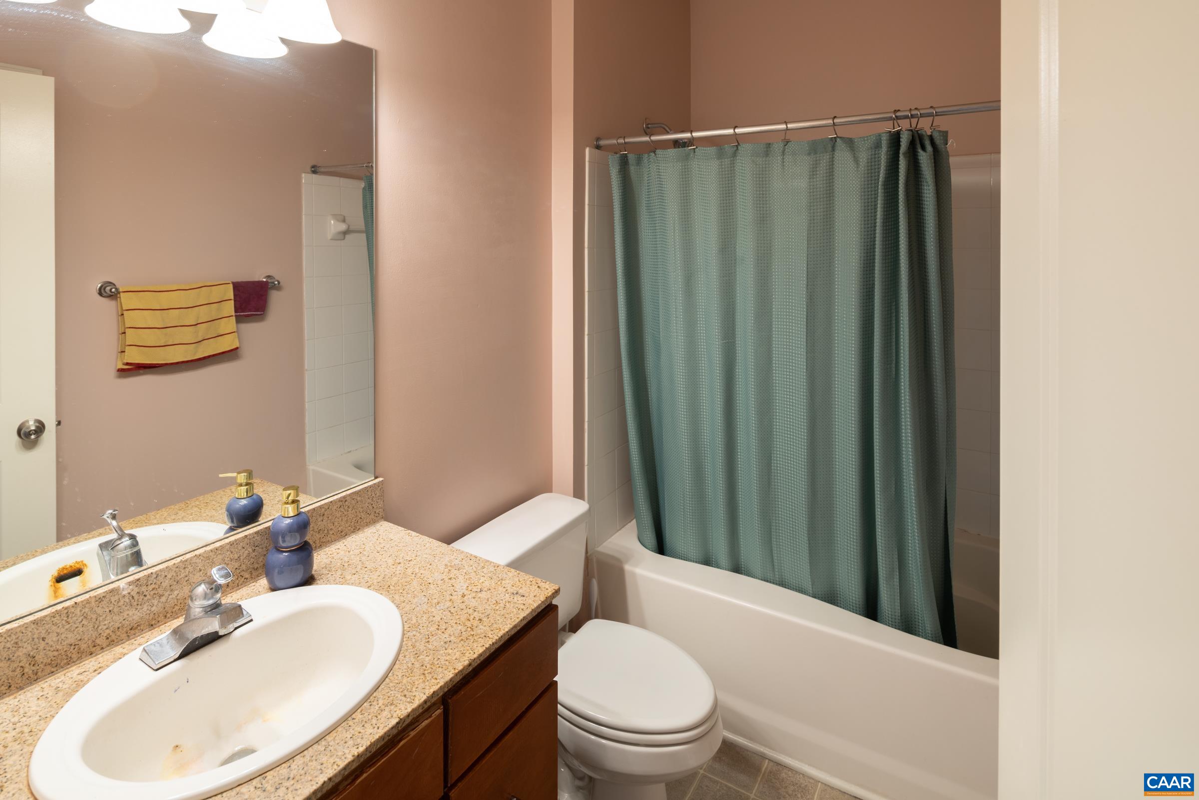 750 Walker Square, Unit 3D Charlottesville, VA 22903 - Photo 18 of 18 a bathroom with a sink toilet and shower
