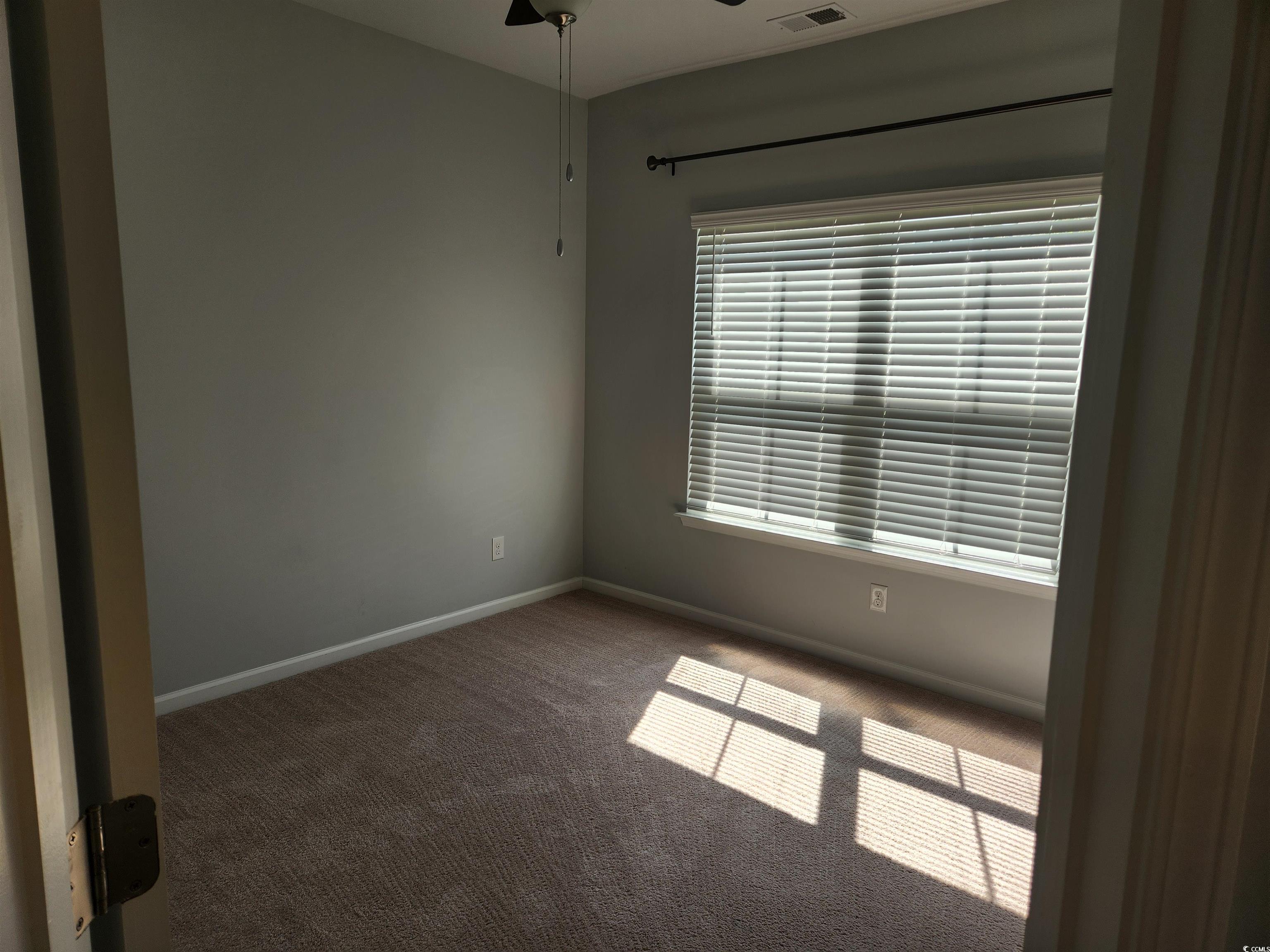174 Sea Shell Drive Murrells Inlet, SC 29576 - Photo 13 of 16 Carpeted empty room featuring baseboards