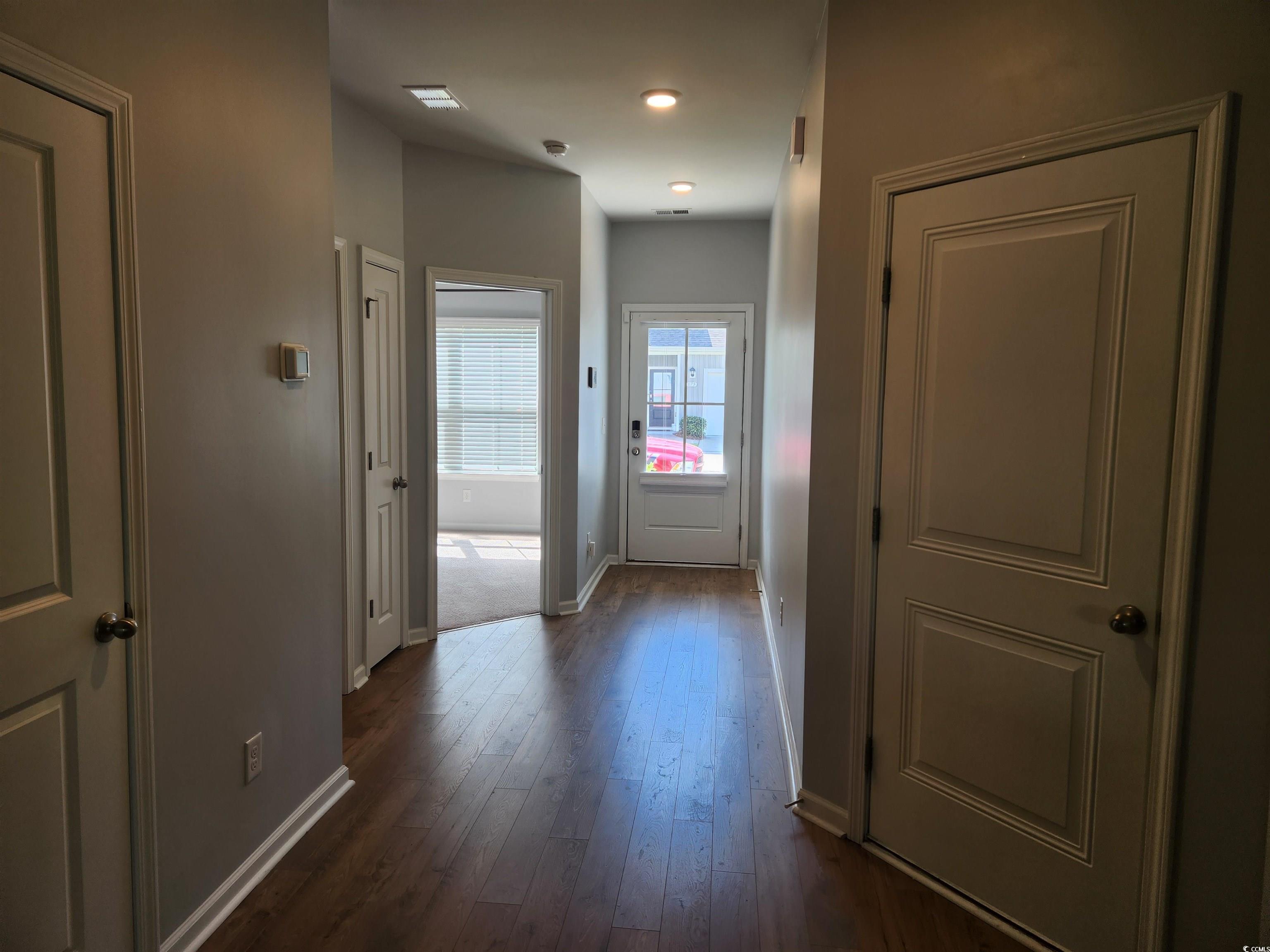 174 Sea Shell Drive Murrells Inlet, SC 29576 - Photo 2 of 16 Corridor with baseboards and dark wood-style flooring