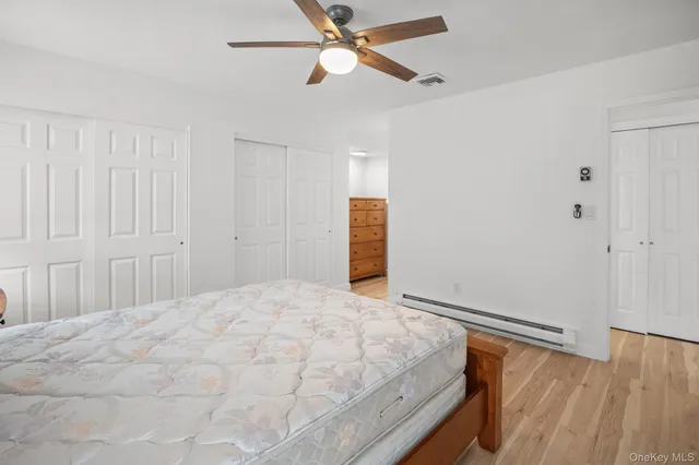 a room with a bed and window