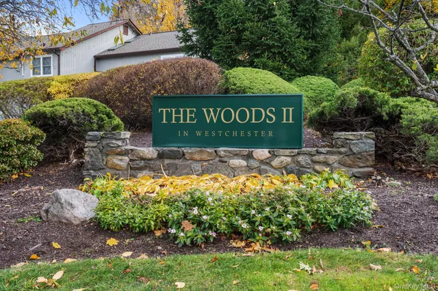 a house view with swimming pool in front of it