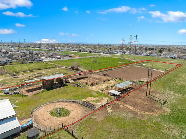 5321 South 3100th Street West Roy, UT 84067 - Photo 63 of 64 Expansive property featuring multiple fenced enclosures, a round pen, and a large arena area