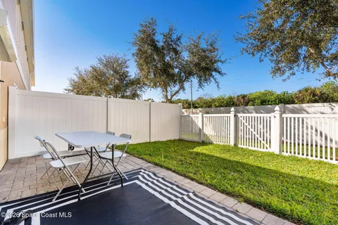 a view of a chair and table on the wooden floor