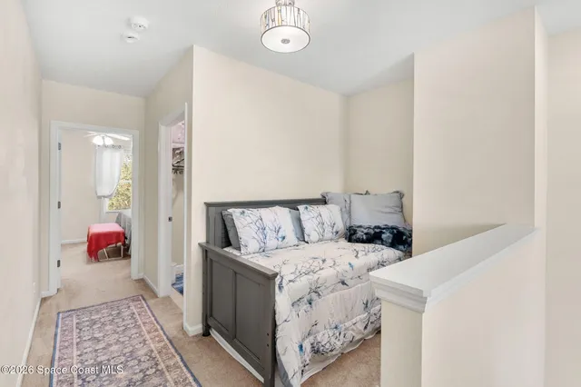 a bed room with a bed and a window