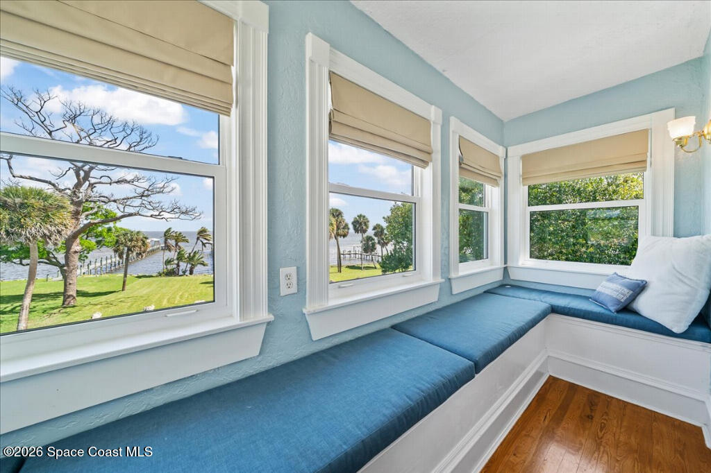 1110 Riverside Drive Titusville, FL 32780 - Photo 25 of 50 a living room with large window and a table