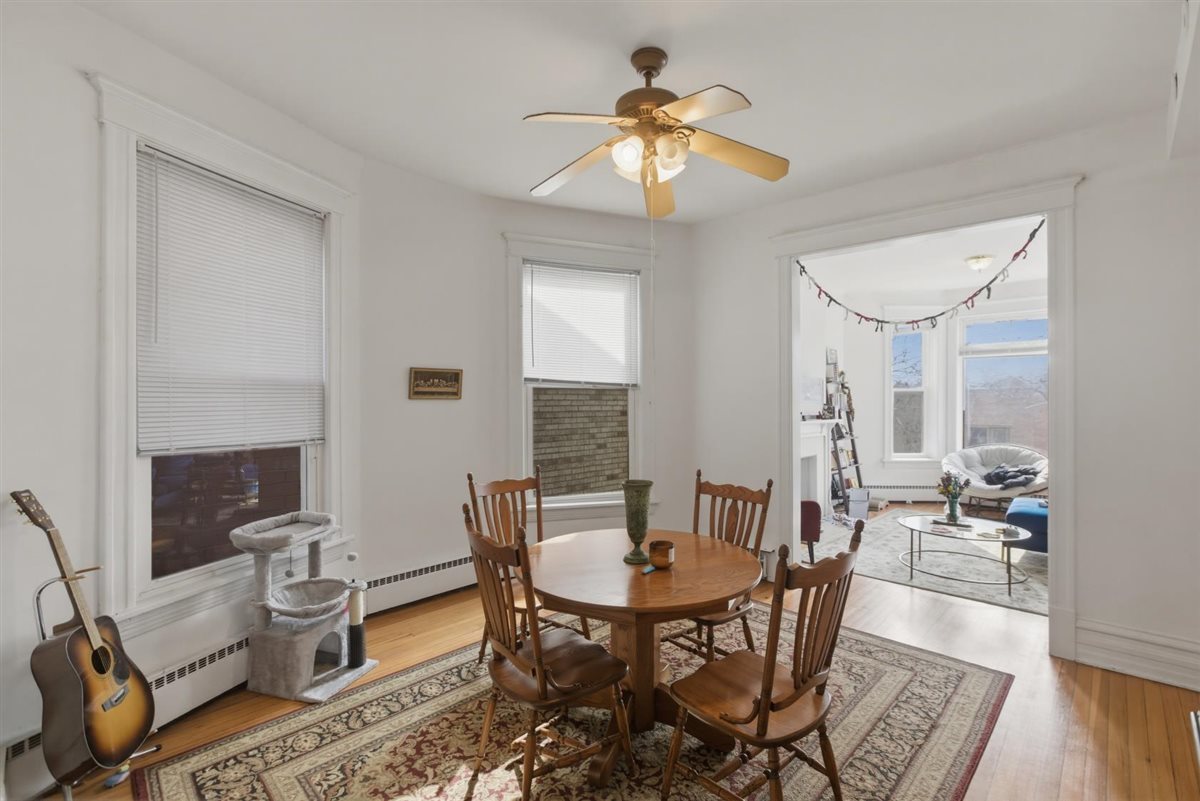 3507 North Seminary Avenue, Unit 2F Chicago, IL 60657 - Photo 4 of 10 a view of a a dining room with furniture window and wooden floor