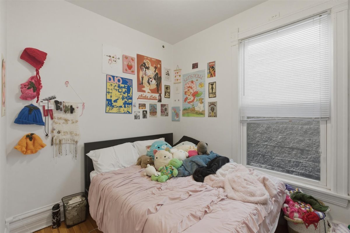 3507 North Seminary Avenue, Unit 2F Chicago, IL 60657 - Photo 7 of 10 a bedroom with a bed and a window