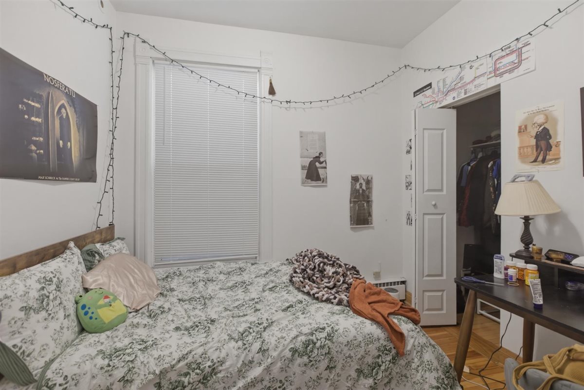 3507 North Seminary Avenue, Unit 2F Chicago, IL 60657 - Photo 8 of 10 a bedroom with a bed and a window