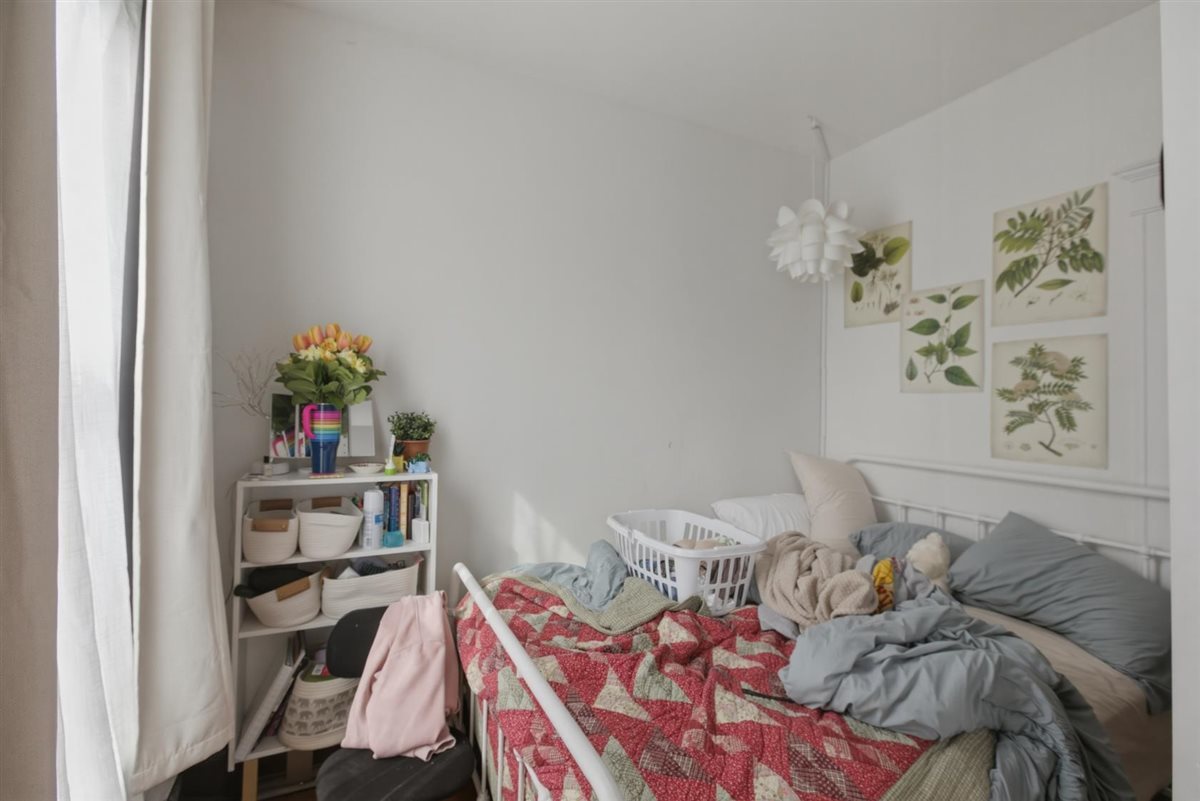 3507 North Seminary Avenue, Unit 2F Chicago, IL 60657 - Photo 9 of 10 a bed room with a bed and a book shelf