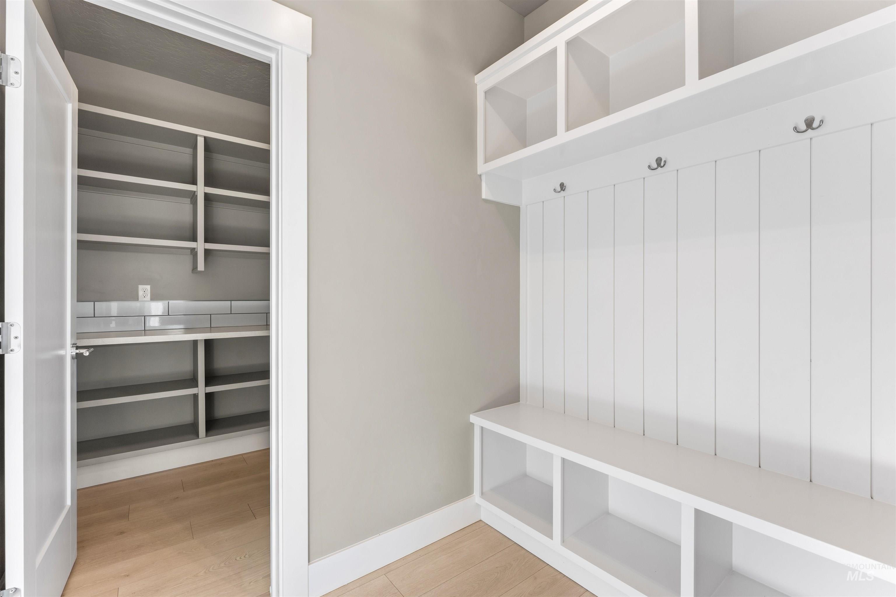 8097 Tandy Cove Street Middleton, ID 83644 - Photo 16 of 37 Mudroom featuring baseboards and light wood-style flooring
