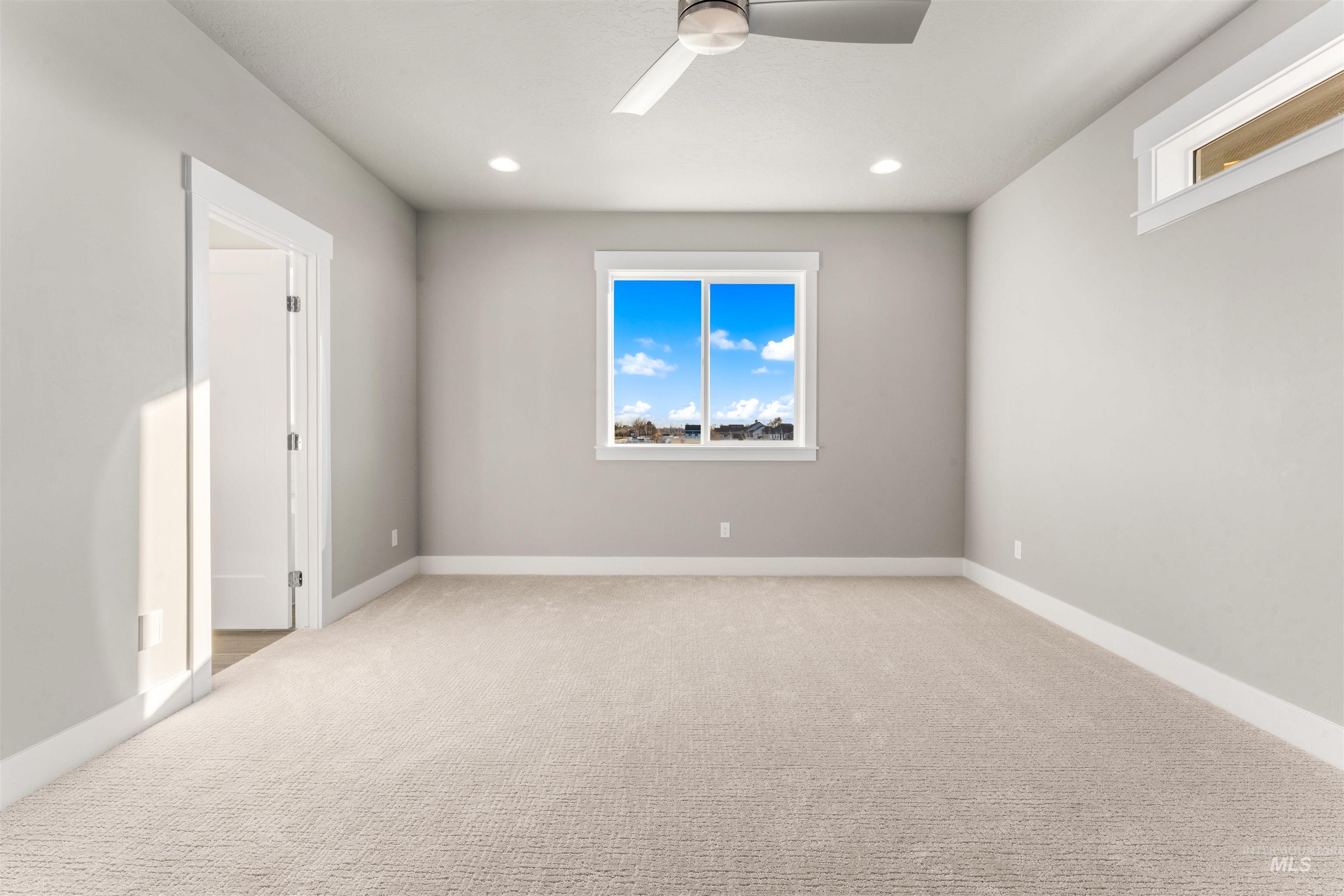 8097 Tandy Cove Street Middleton, ID 83644 - Photo 18 of 37 Spare room featuring light carpet, ceiling fan, and recessed lighting