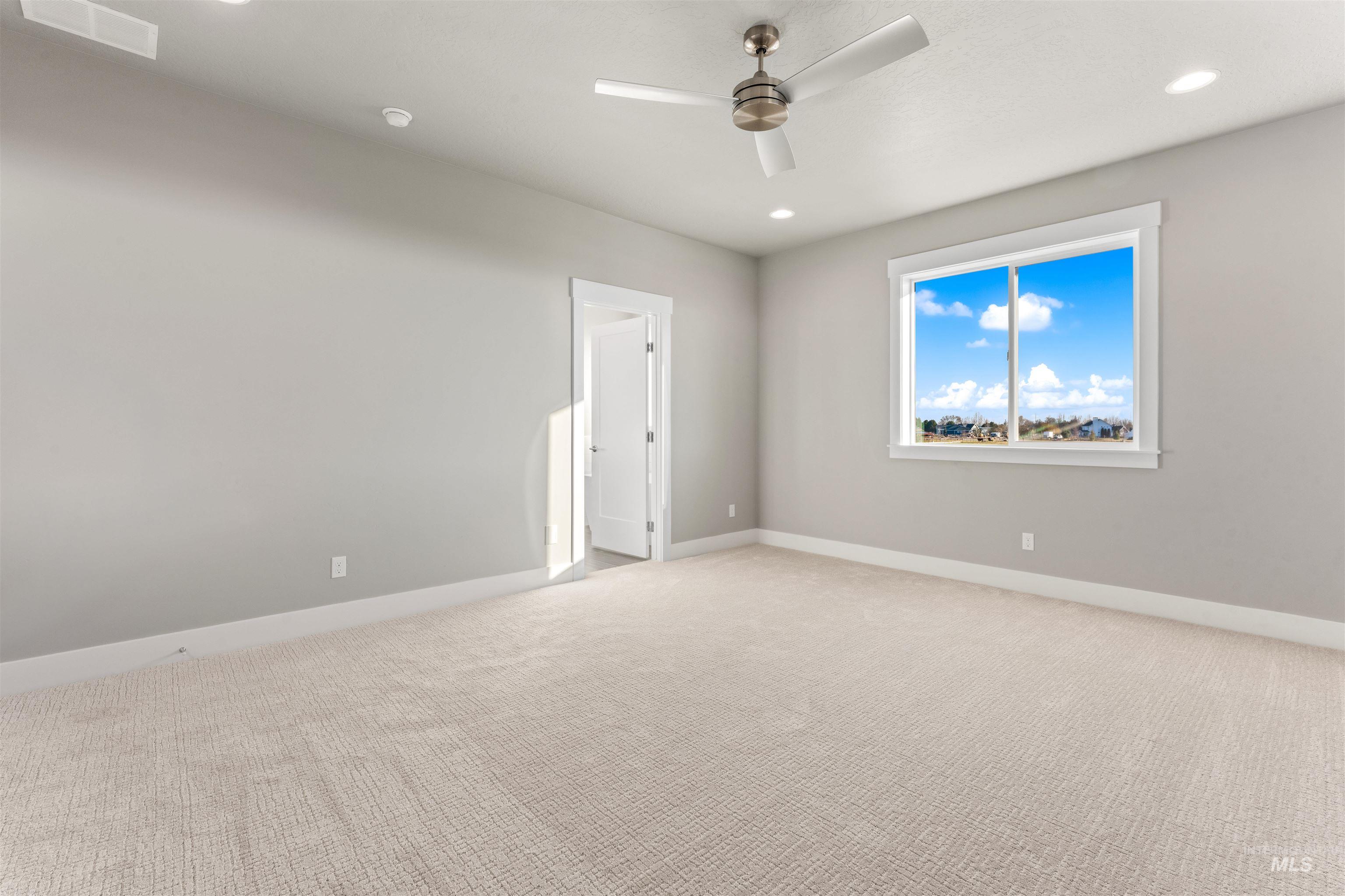 8097 Tandy Cove Street Middleton, ID 83644 - Photo 19 of 37 Empty room with light carpet, a ceiling fan, and recessed lighting