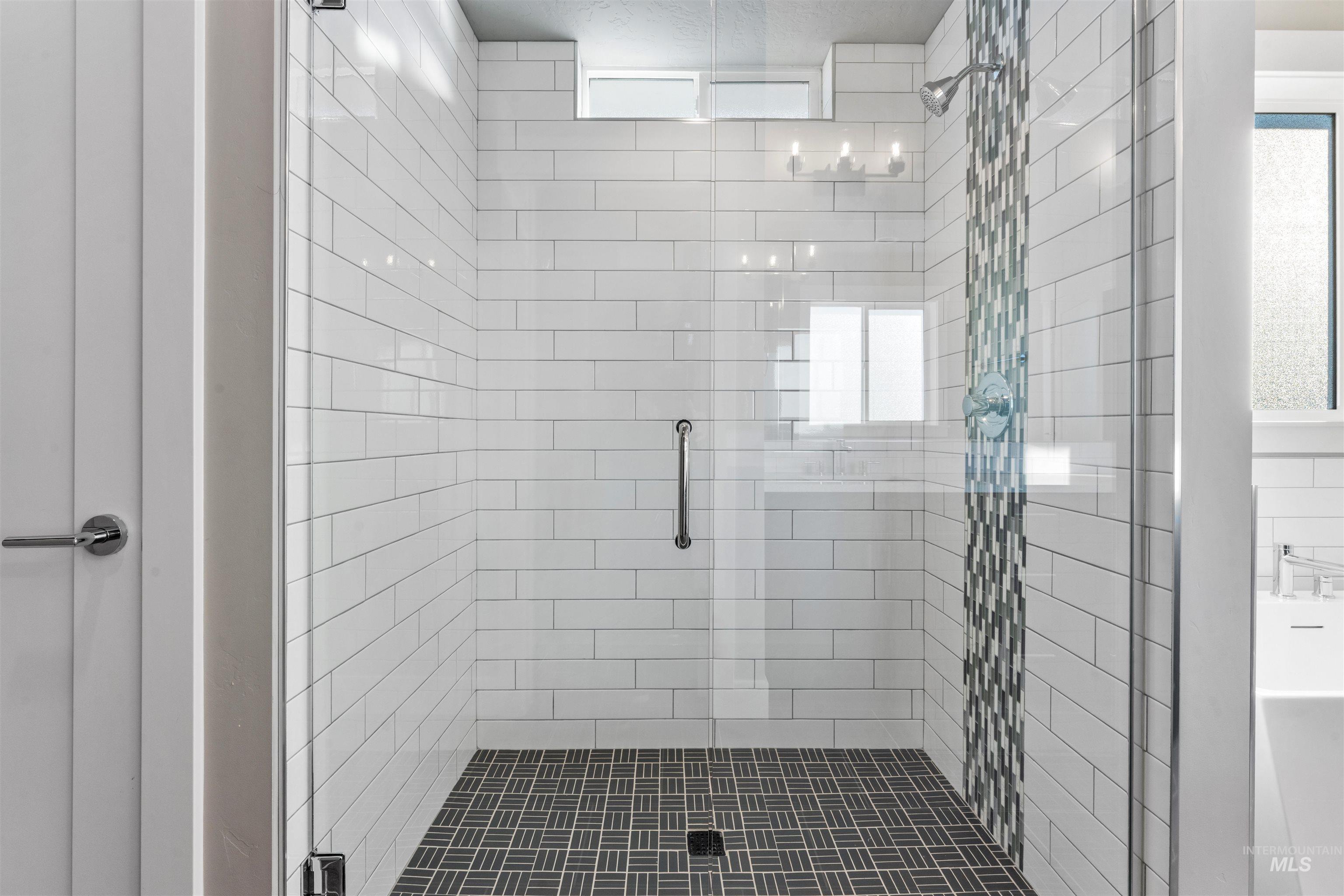 8097 Tandy Cove Street Middleton, ID 83644 - Photo 23 of 37 Bathroom featuring a stall shower and plenty of natural light