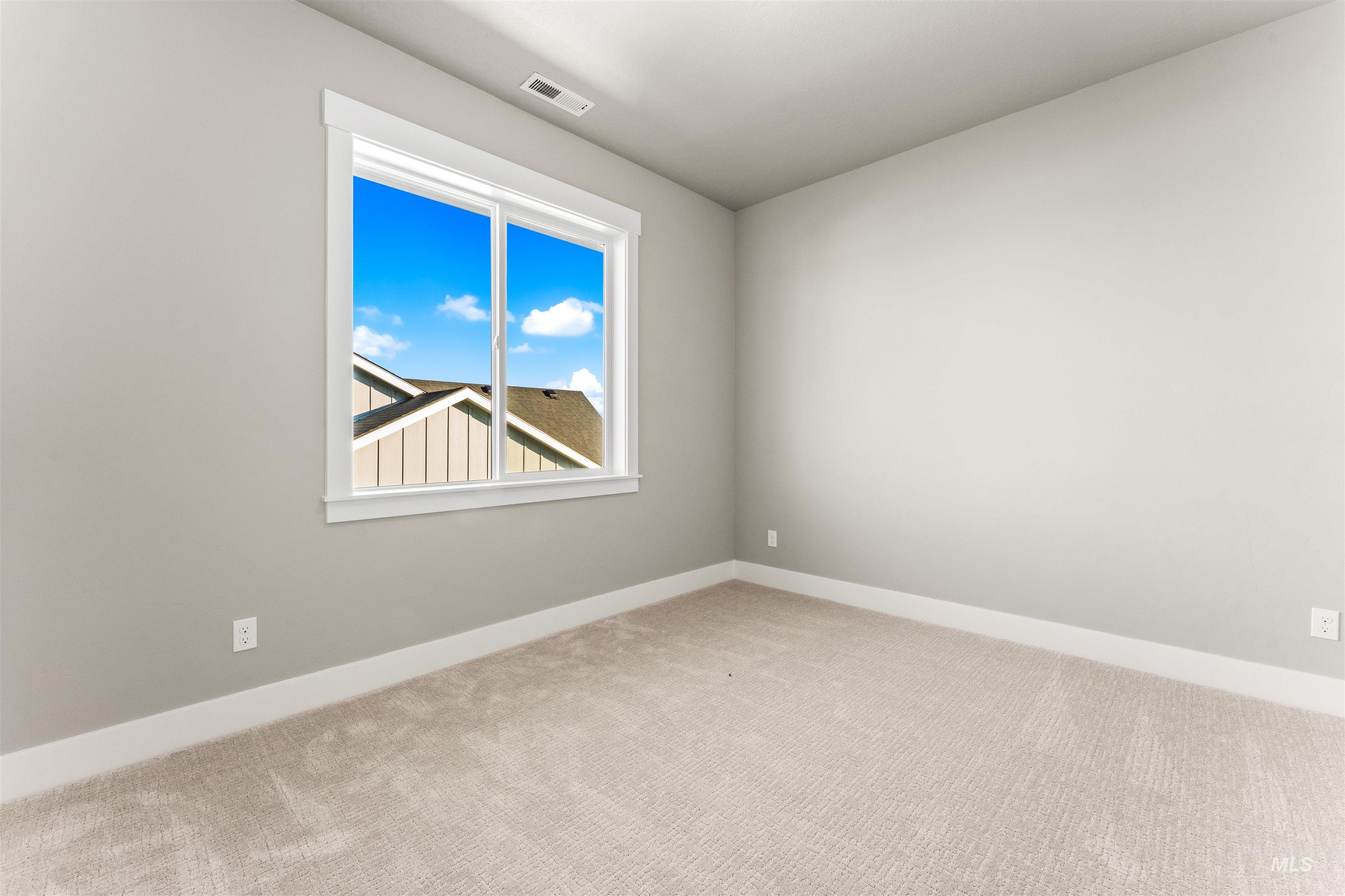 8097 Tandy Cove Street Middleton, ID 83644 - Photo 34 of 37 Unfurnished room with light colored carpet and baseboards
